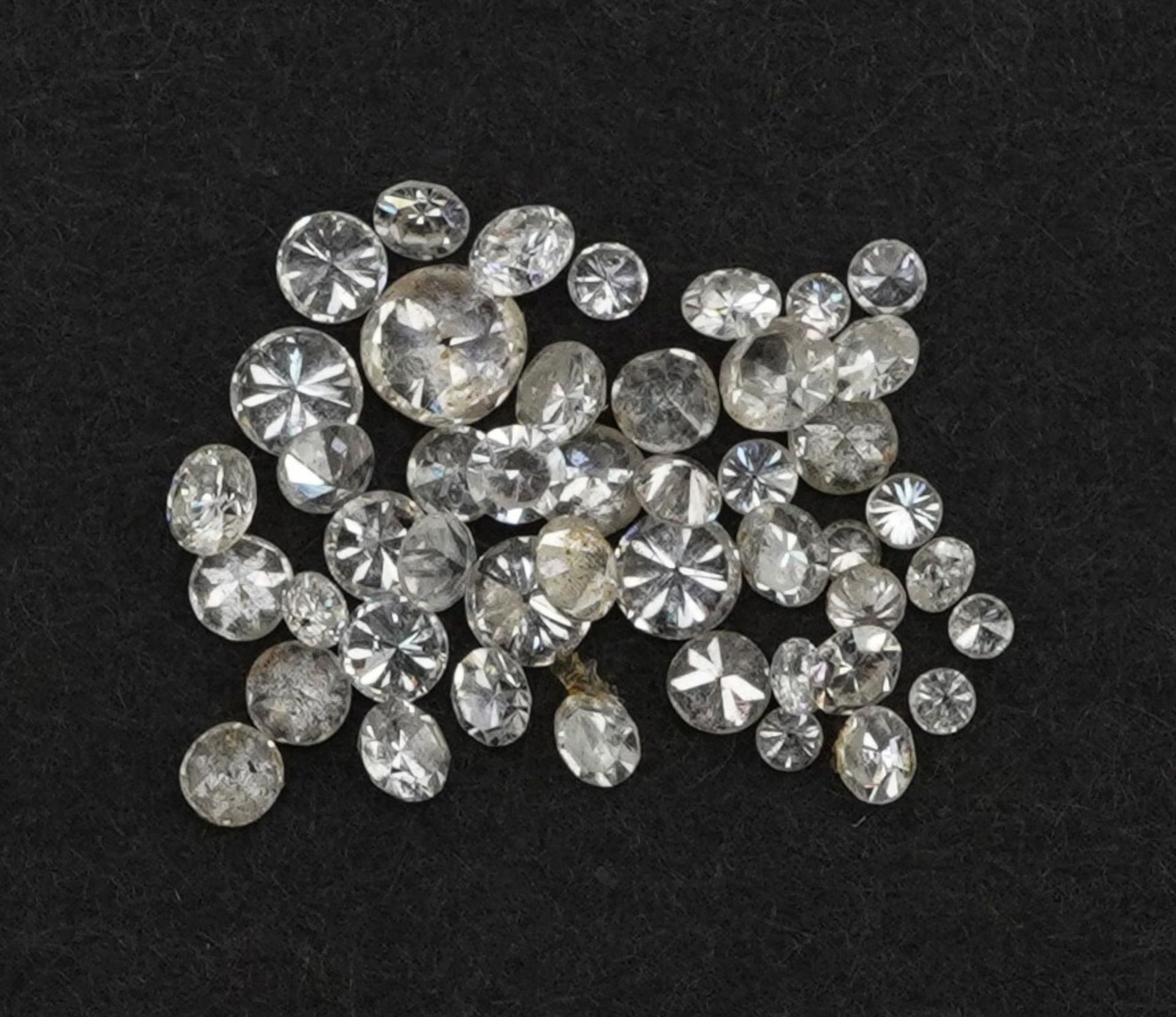 Collection of loose solitaire diamonds, the largest approximately 2.9mm in diameter, total weight