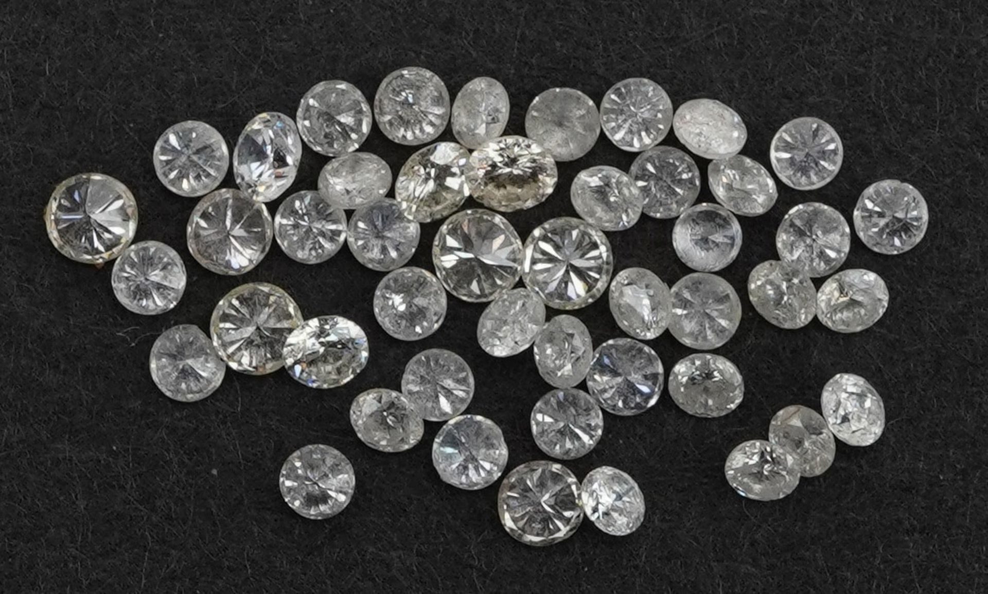 Collection of loose solitaire diamonds, the largest approximately 1.9mm in diameter, total weight