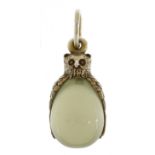 Silver mounted jade egg pendant in the form of an owl, impressed Russian marks, 3cm high, 5.4g : For