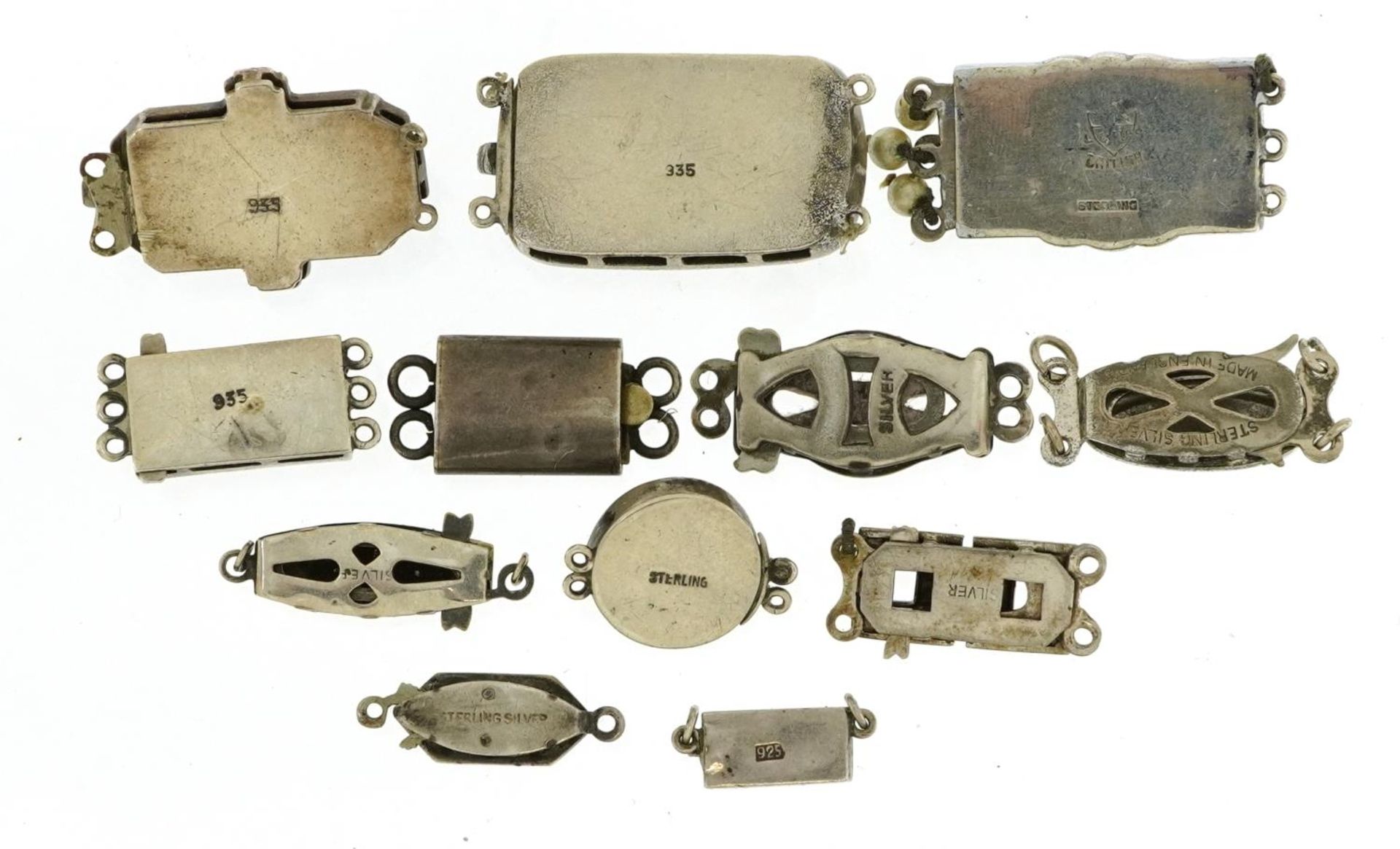 Twelve silver clasps including Art Deco marcasite and paste set examples, the largest 2.7cm wide, - Image 2 of 3