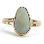 Unmarked gold cabochon opal ring, tests as 18ct gold, the opal approximately 12.0mm x 7.0mm, size O,