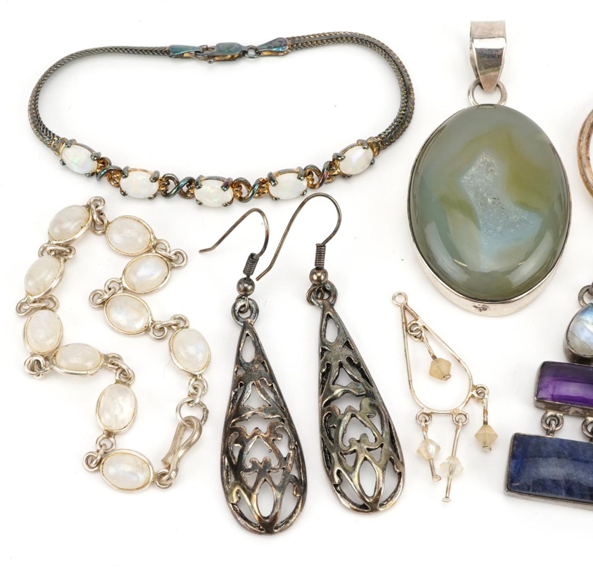 Silver and white metal jewellery including two cabochon pendants, drop earrings and two bracelets, - Image 2 of 5