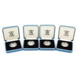 Four United Kingdom silver proof one pound coins by The Royal Mint with certificates and cases