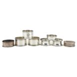 Eight circular silver napkin rings, various hallmarks, the largest 4.8cm in diameter, total 119.0g :