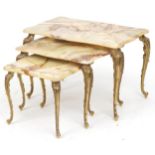 Nest of two gilt brass and onyx occasional tables with serpentine outline, the largest 40cm H x 60cm