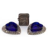 William Henry Leather, pair of silver love heart shaped open salts with blue glass liners and a