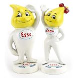 Pair of painted Esso advertising cast iron money boxes comprising Andy Slick and Abby Slick, the