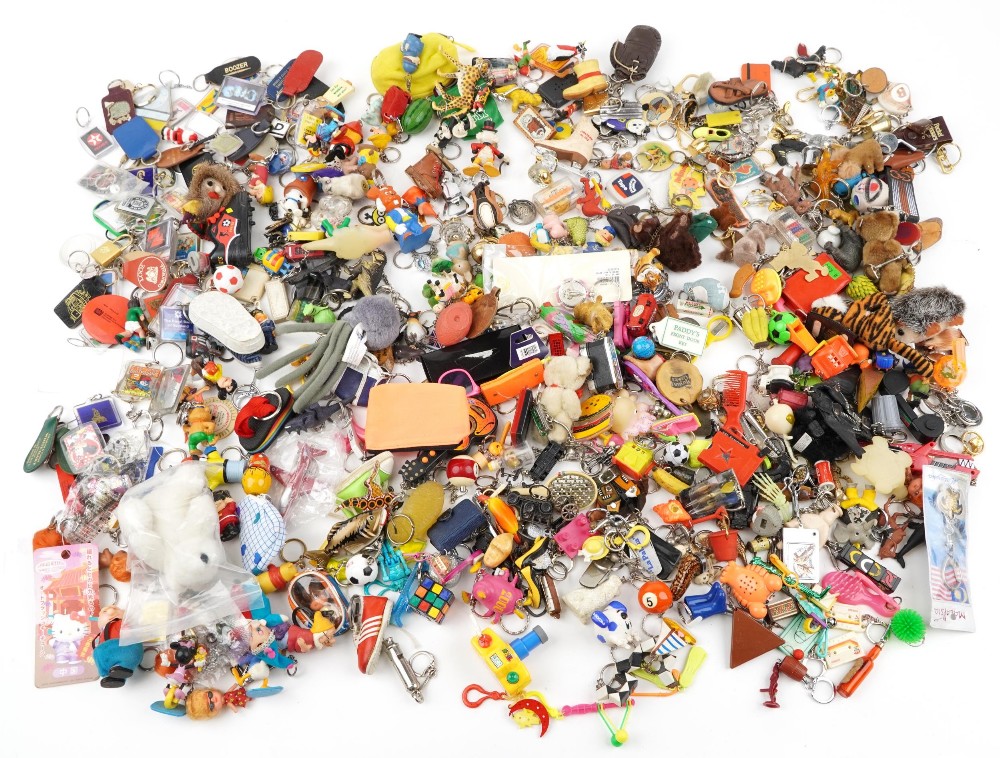Large collection of vintage and later keyrings including Disney figures, Magic Roundabout, The