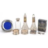 Silver and white metal objects including a pair of cut glass scent bottles with silver collars,