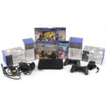 Sony PlayStation 2 slimline games console with two controllers, Eye Toy and a collection of