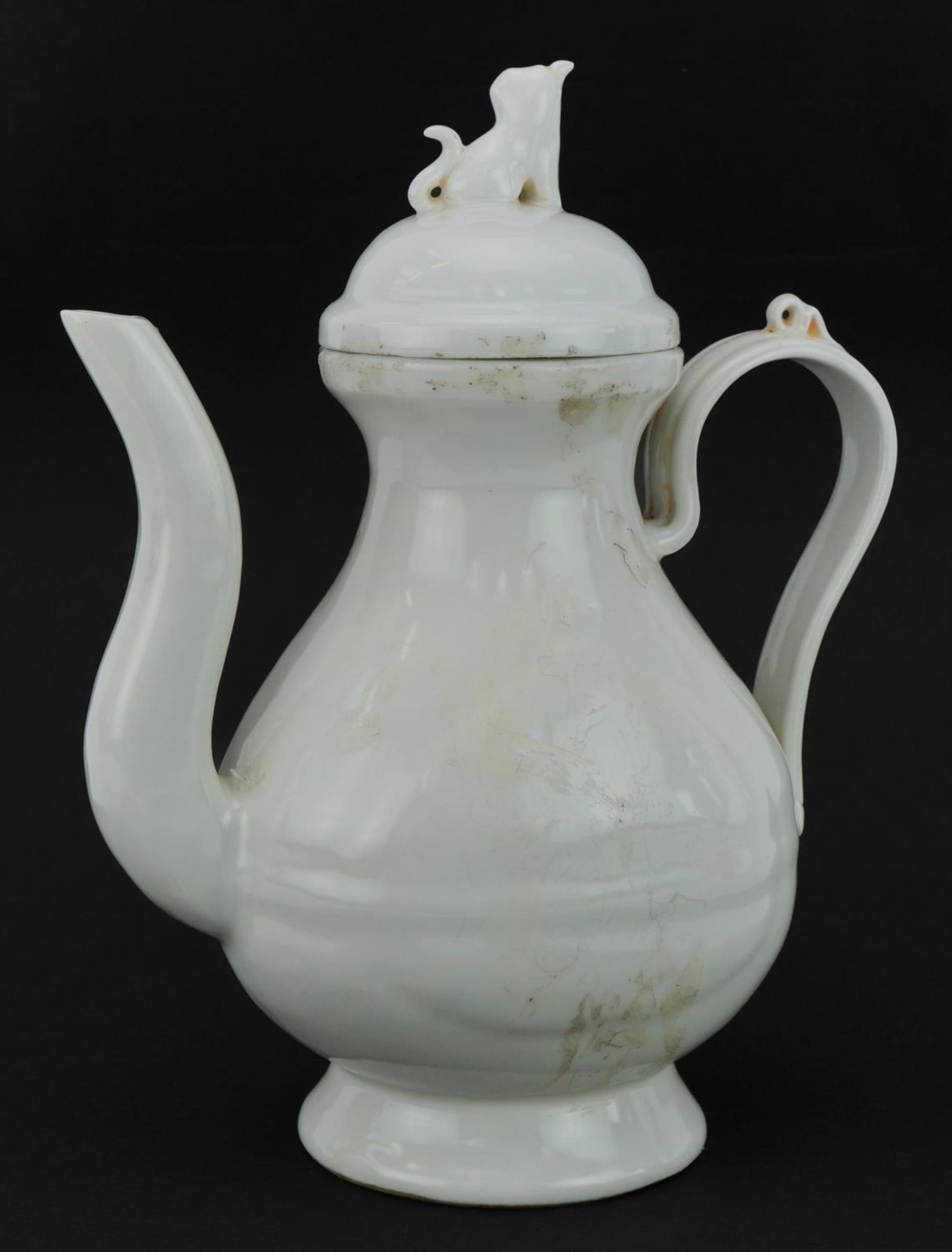 Chinese porcelain water pot having a blanc de chine glaze incised with flowers, four figure