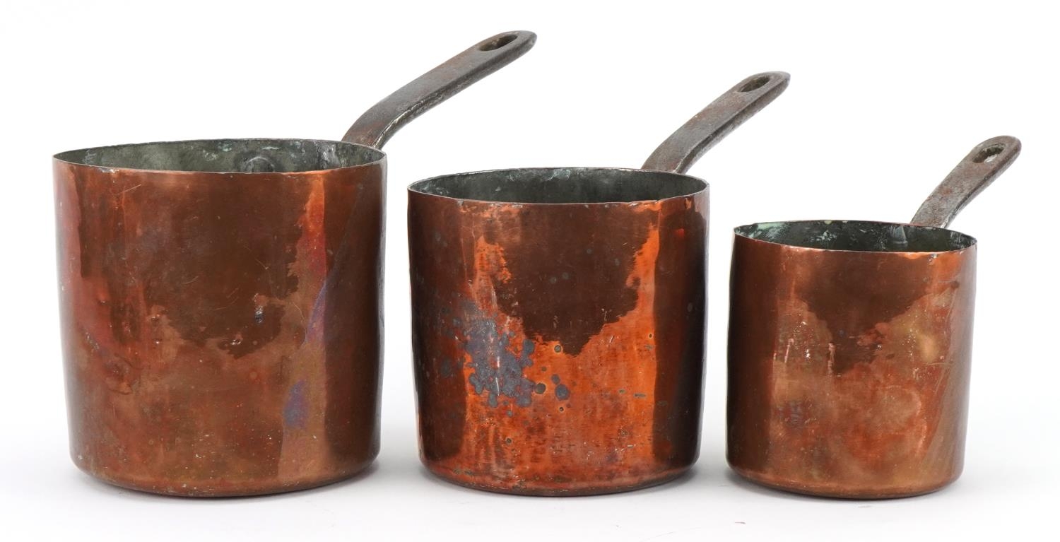 Three 19th century copper saucepans by Jones Bros, Downing Street, the largest 24.5cm in length :