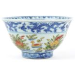 Chinese doucai porcelain bowl hand painted with ducklings in water amongst flowers, six figure