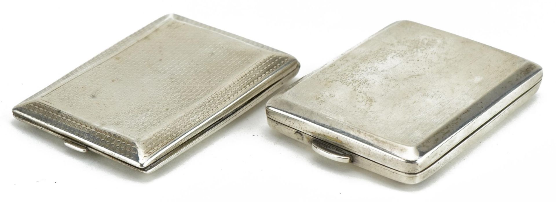 Two George V rectangular silver match cases, Birmingham 1926 and Chester 1929, 6cm in length, 69.