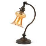 Early 20th century adjustable brass desk lamp with iridescent glass shade, 32.5cm high : For further