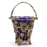 John Henry Odell, Elizabeth II silver gilt basket with swing handle and blue glass liner cast with