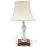 Chinese porcelain blanc de chine glazed Guanyin table lamp raised on a hardwood stand with shade,