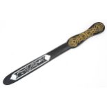 Islamic ebonised Quran opener with mother of pearl inlay decorated with calligraphy, 37cm in
