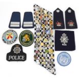 Police badges and epaulettes and badges including Sussex Police, City of North Vancouver and