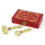 Two Chinese green hardstone massage rollers with fitted box, 14cm wide : For further information