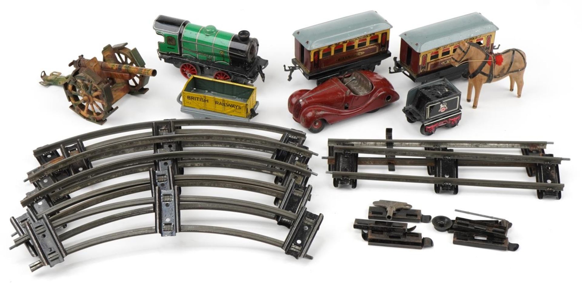 Vintage toys including a Schuco Examico 4001, Hornby O gauge locomotive with Pullman coaches and