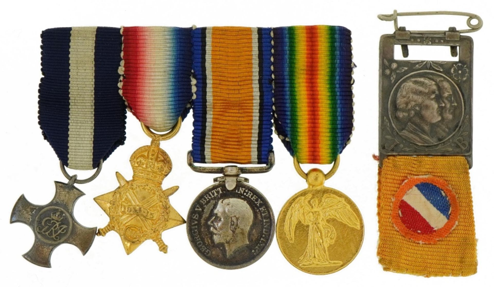 Set of four British military World War I dress medals including a trio and a French badge : For