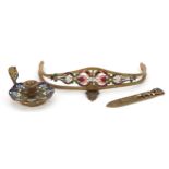 French brass and champleve enamel comprising a chamberstick, handle and foliate bookmark, the