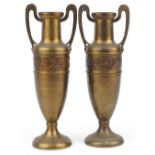 Pair of continental Art Nouveau brass vases with twin handles decorated with a continuous band of
