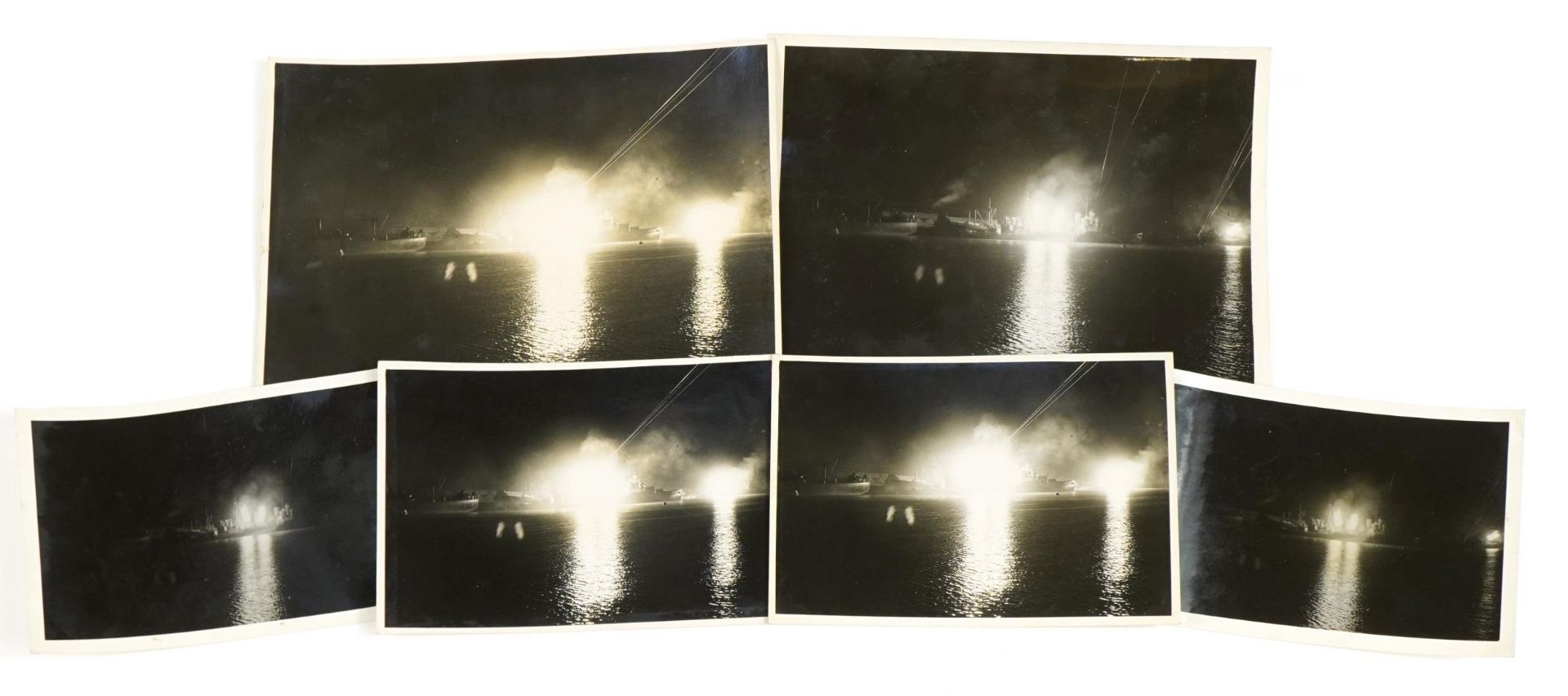 Six British military World War II naval photographs of ship explosions, each with Ministry of