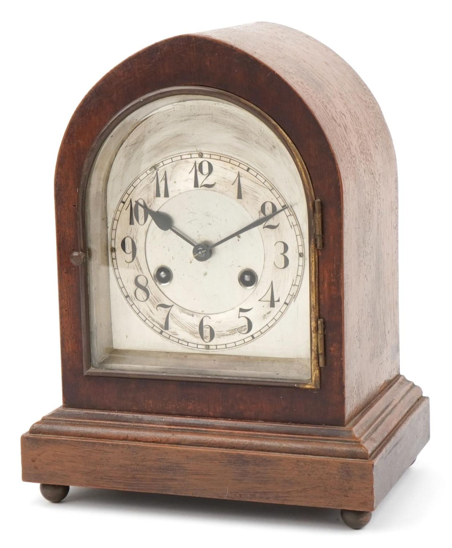 Gothic style oak cased arch top mantle clock striking on a gong having a silvered chapter ring