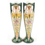 Pair of European Art Nouveau twin handled vases hand painted with stylised animals and faces, each