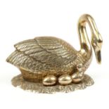 Large gilt brass study of a swan with eggs in a nest, 36cm in length : For further information on