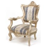 French style ornate gilt open armchair with blue and cream striped floral upholstery, 110cm high :