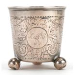 Antique silver cup with three ball feet and engraved decoration, possibly Russian, indistinct