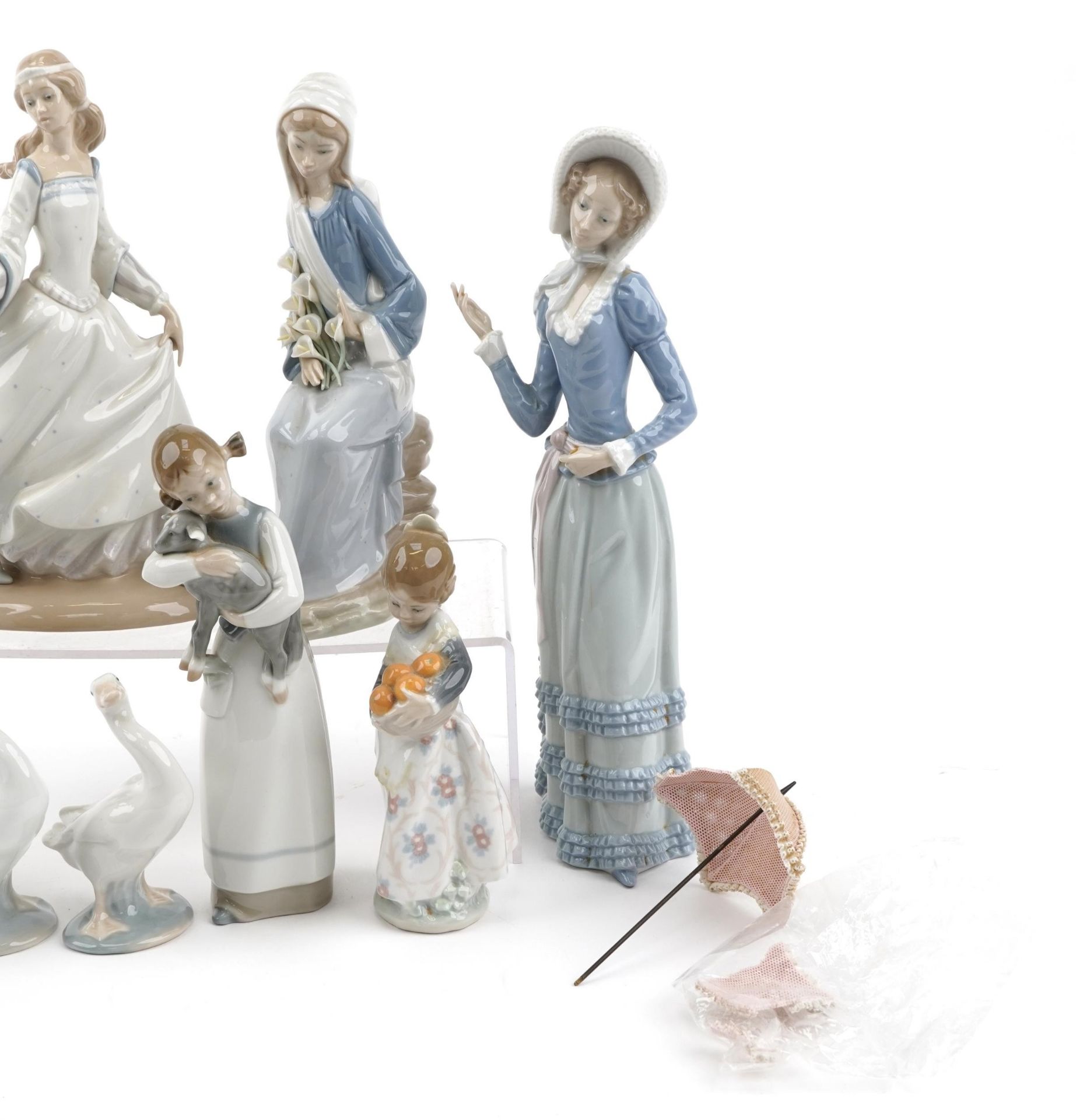 Nine Lladro porcelain figures and animals including a young Pierrot, girl with oranges and girl with - Image 3 of 4