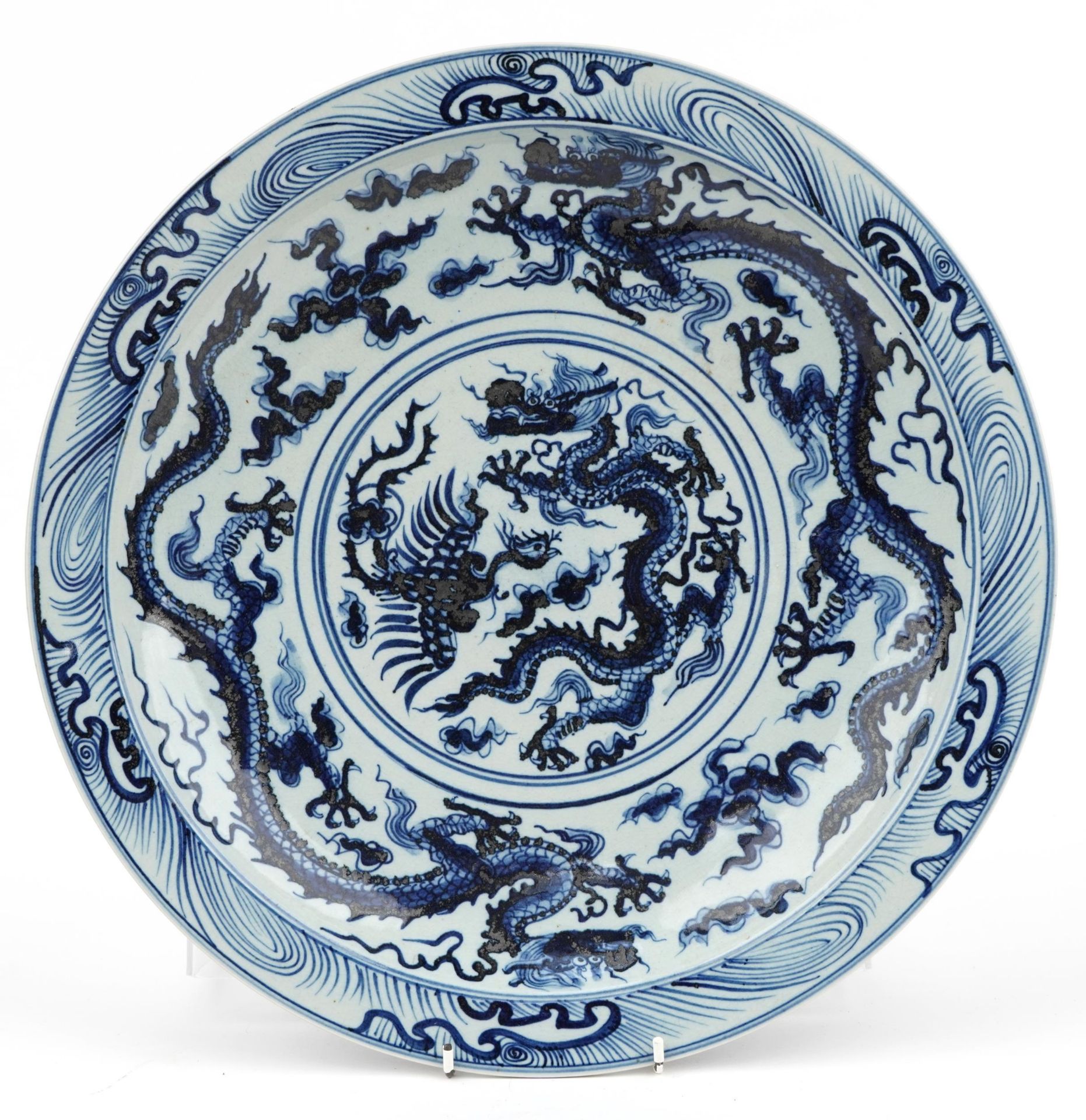 Chinese blue and white porcelain charger hand painted with dragons amongst clouds, character marks