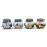 Four Victorian porcelain pots with embossed silver lids, each decorated with lovers, each lid London