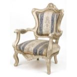 French style ornate gilt open armchair with blue and cream striped floral upholstery, 110cm high :
