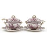 Pair of Victorian pottery lidded sauce tureens on stands with ladles, each decorated with pastoral