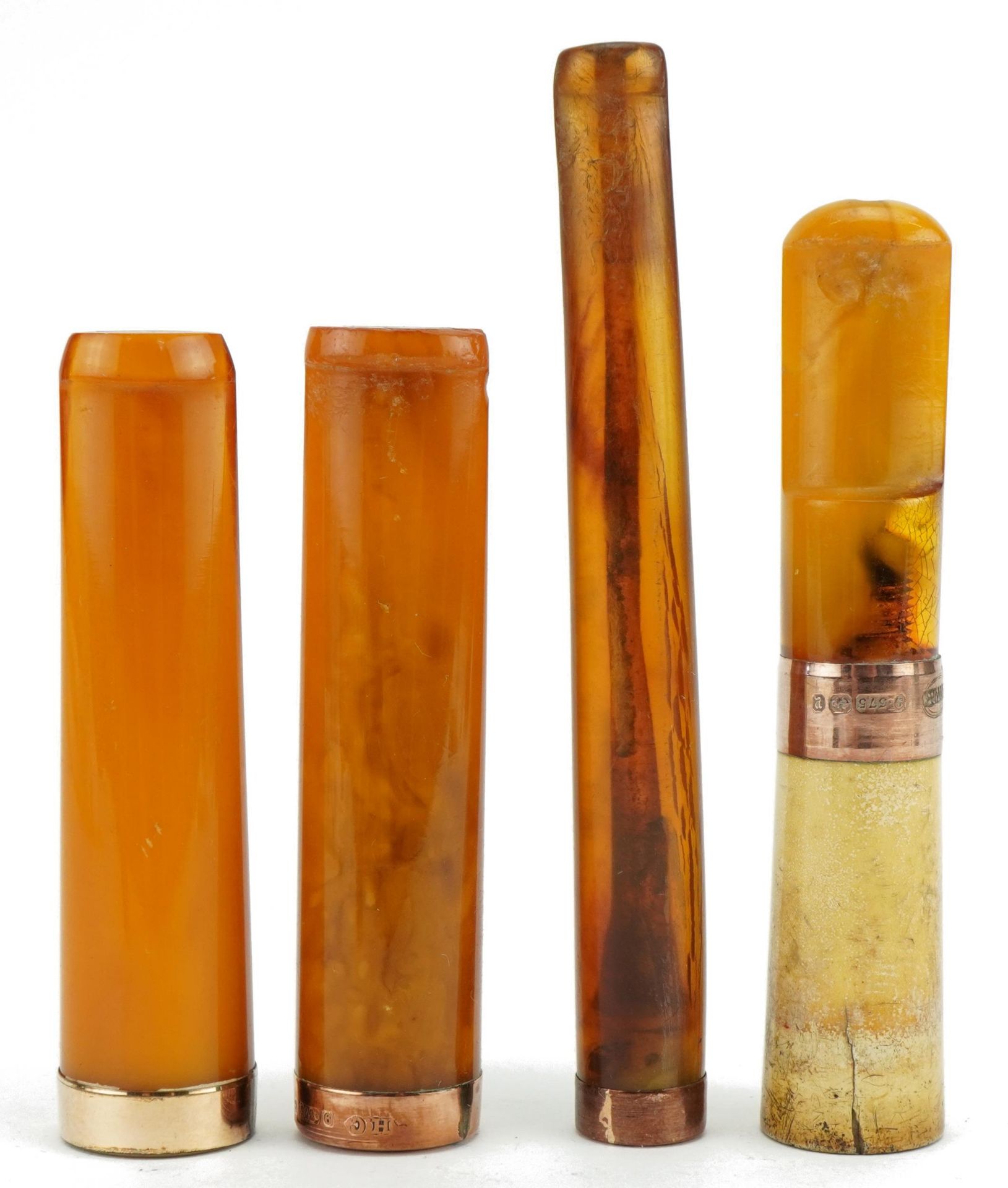 Four late 19th/early 20th century amber and amber coloured cigarette holders with 9ct gold and - Image 2 of 4