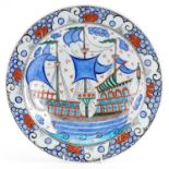 Turkish Iznik pottery plate hand painted with ships and stylised flowers, 31cm in diameter : For