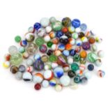 Collection of antique and later glass marbles including latticinio and milk glass examples, the