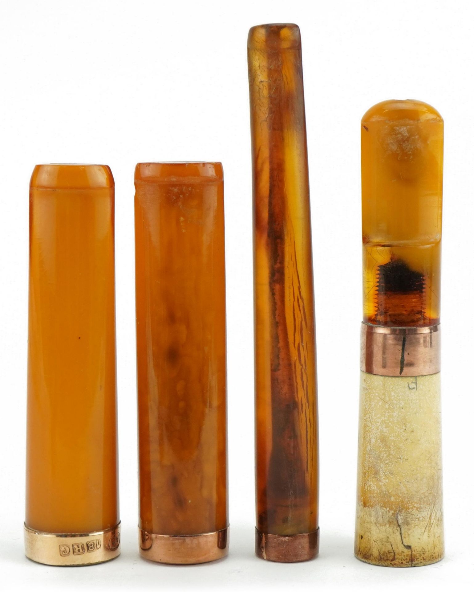 Four late 19th/early 20th century amber and amber coloured cigarette holders with 9ct gold and - Image 3 of 4