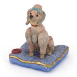 Welsh Porcelain Company study of a seated Poodle signed James R Done, 12cm high : For further
