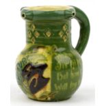 C H Brannam, Arts & Crafts Scraffito pottery puzzle jug hand painted with stylised fish and