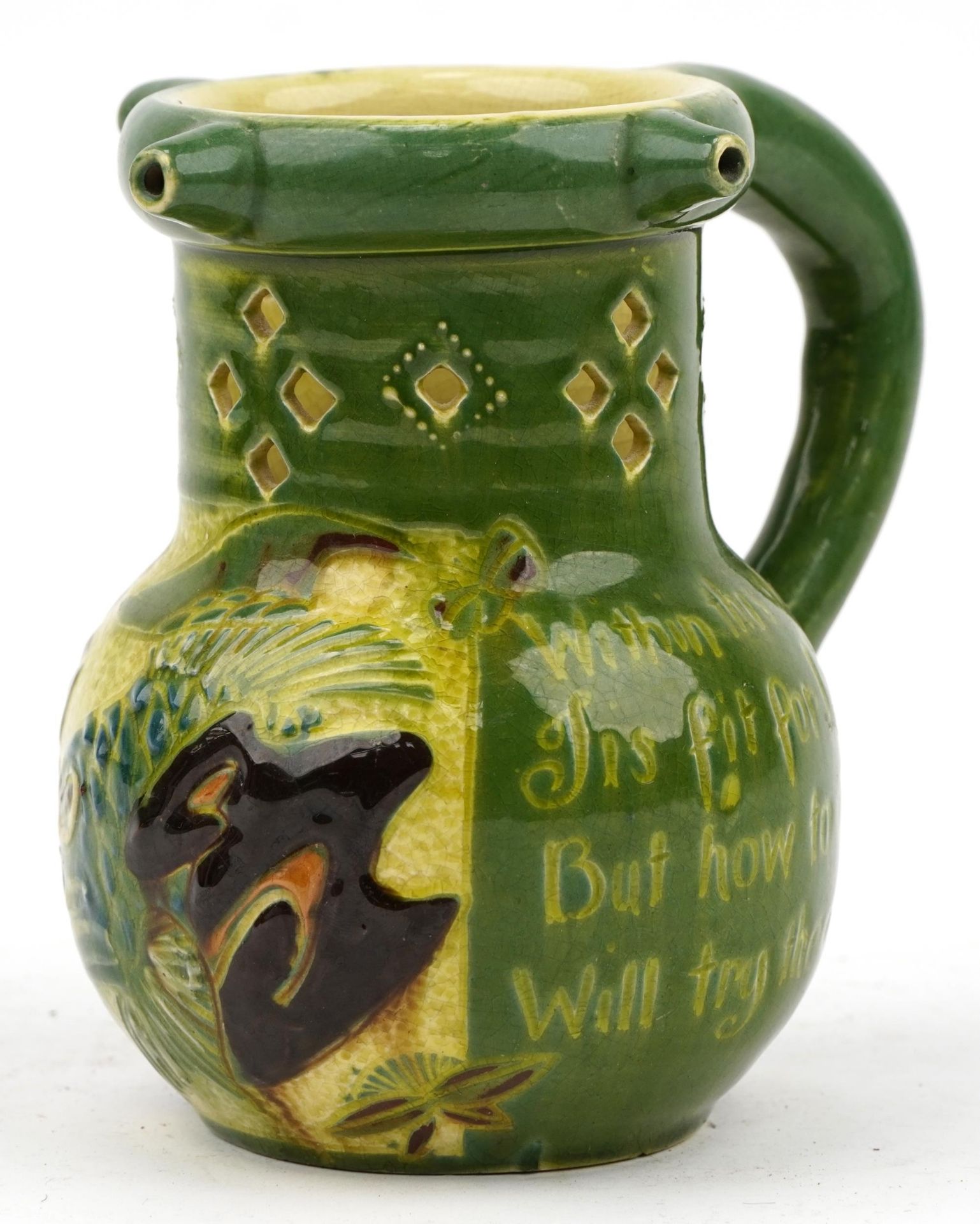 C H Brannam, Arts & Crafts Scraffito pottery puzzle jug hand painted with stylised fish and