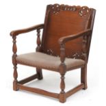 Carved oak metamorphic chair/table with brown leather seat, 55cm high : For further information on