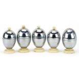 Five vintage Heatmaster egg coddlers, the largest each 10cm high : For further information on this