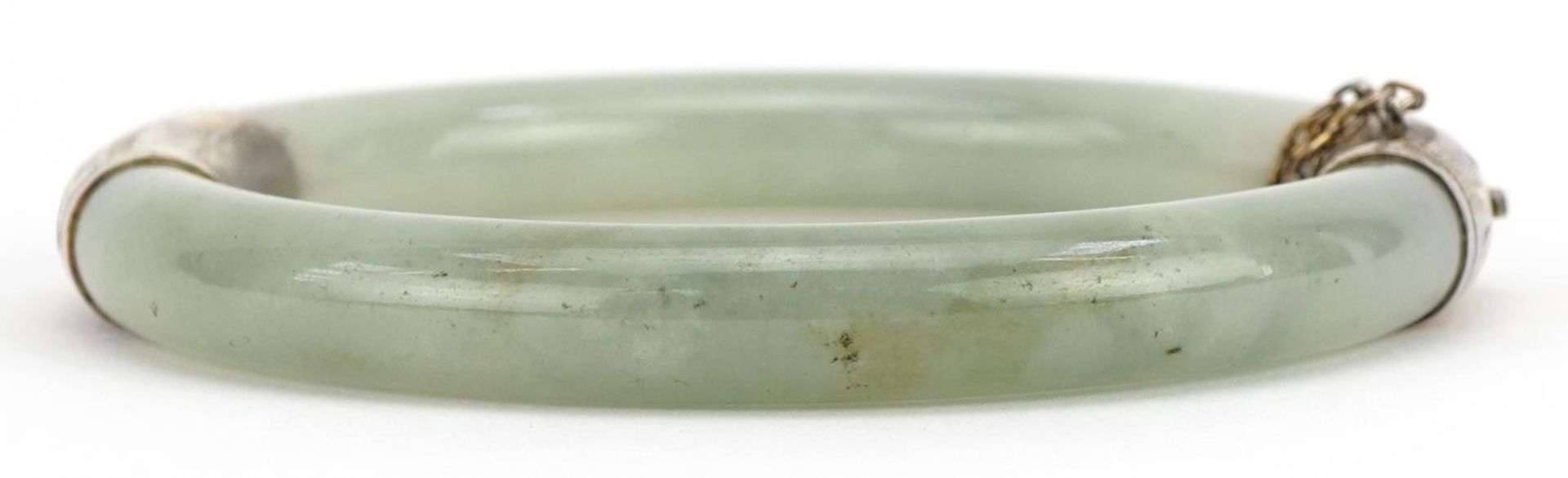 Chinese green jade hinged bangle with silver gilt mounts, 7cm in diameter : For further - Image 2 of 3