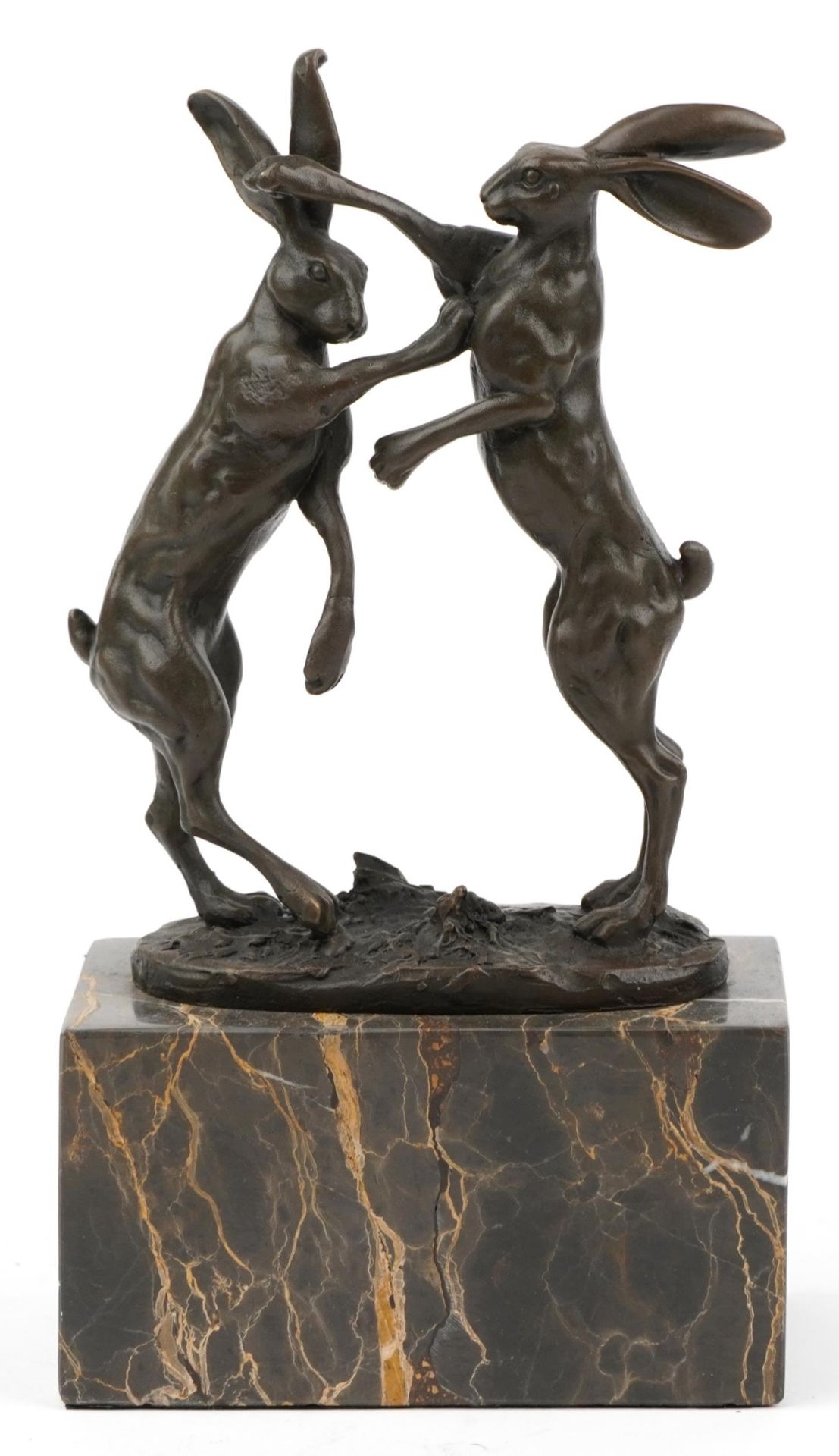 Pair of patinated bronze boxing hares signed Nick, raised on a rectangular marble block base, 24cm
